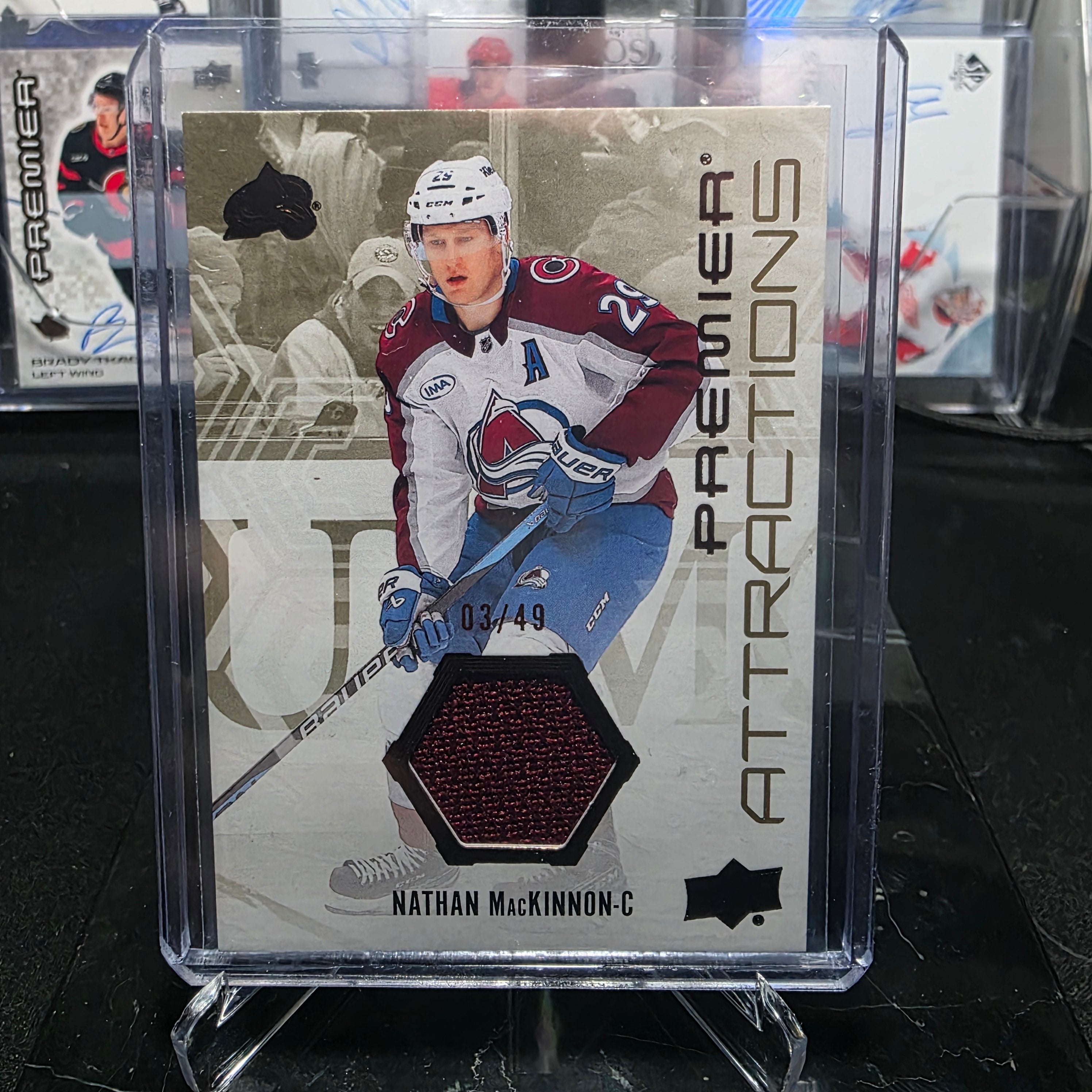 2024-25 Upper Deck Premier Nathan MacKinnon Premier Attractions Jersey PA-NM 03/49